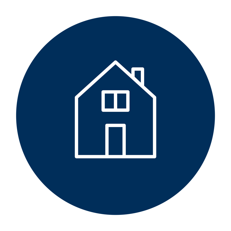 En blå cirkel med ett vitt hus i.