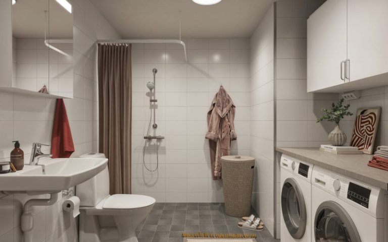 Visualiseringsbild över ett nybyggt badrum. På bilden syns en dusch, en tvättmaskin och torktumlare i ett badrum som går i gråa och beiga toner. 