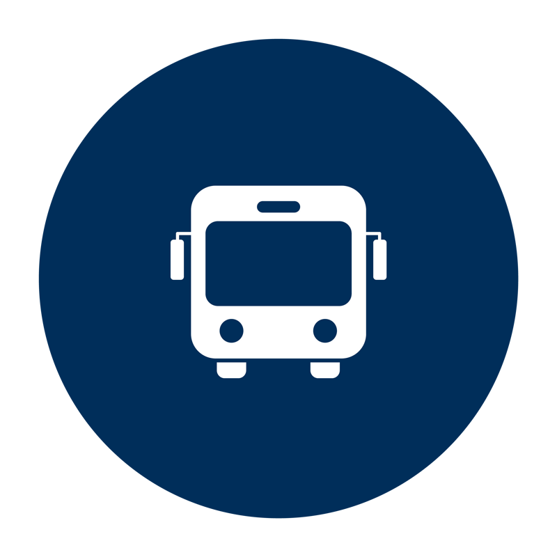 En blå cirkel med en buss i.